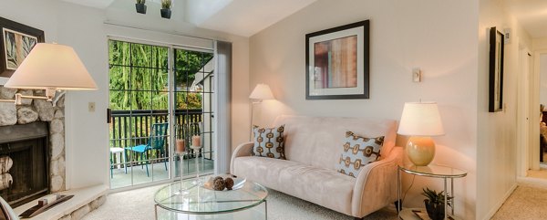 Spacious living room with modern decor at Riverstone Apartments