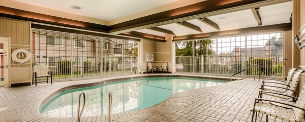 Relaxing outdoor pool at Riverstone Apartments offering tranquil swim experience