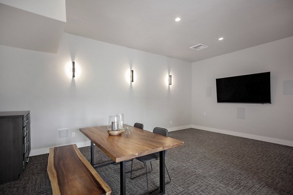 Clubhouse featuring modern design and cozy seating at Trio Pointe luxury apartments