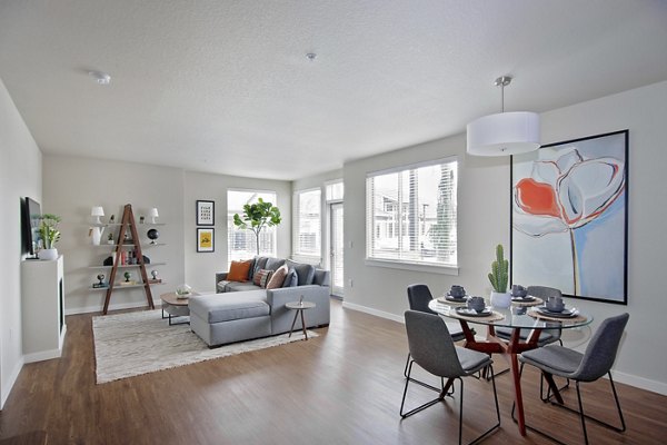 Modern living room featuring stylish decor and natural light at Trio Pointe luxury apartments