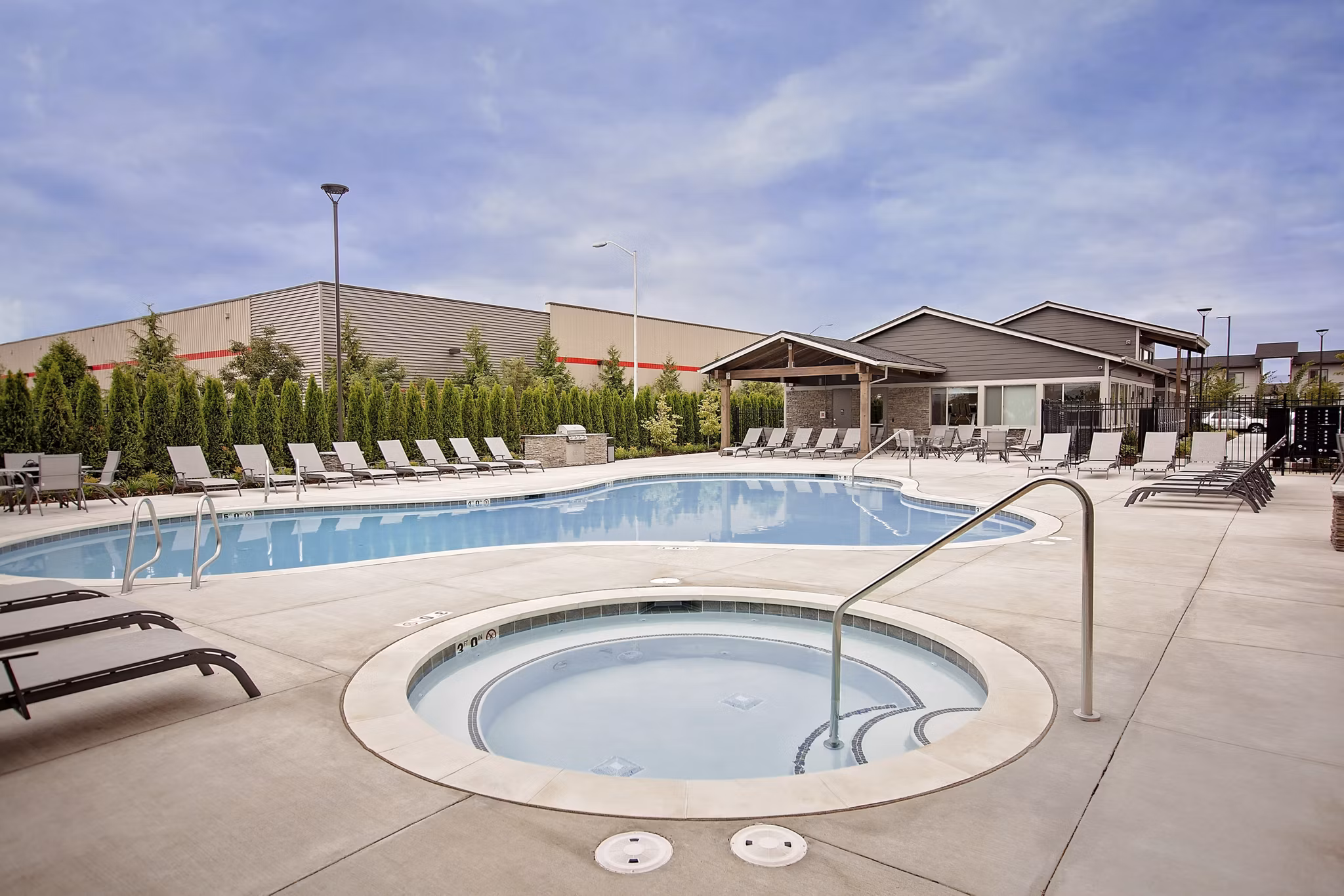 Relaxing outdoor hot tub at Trio Pointe luxury apartments with scenic views