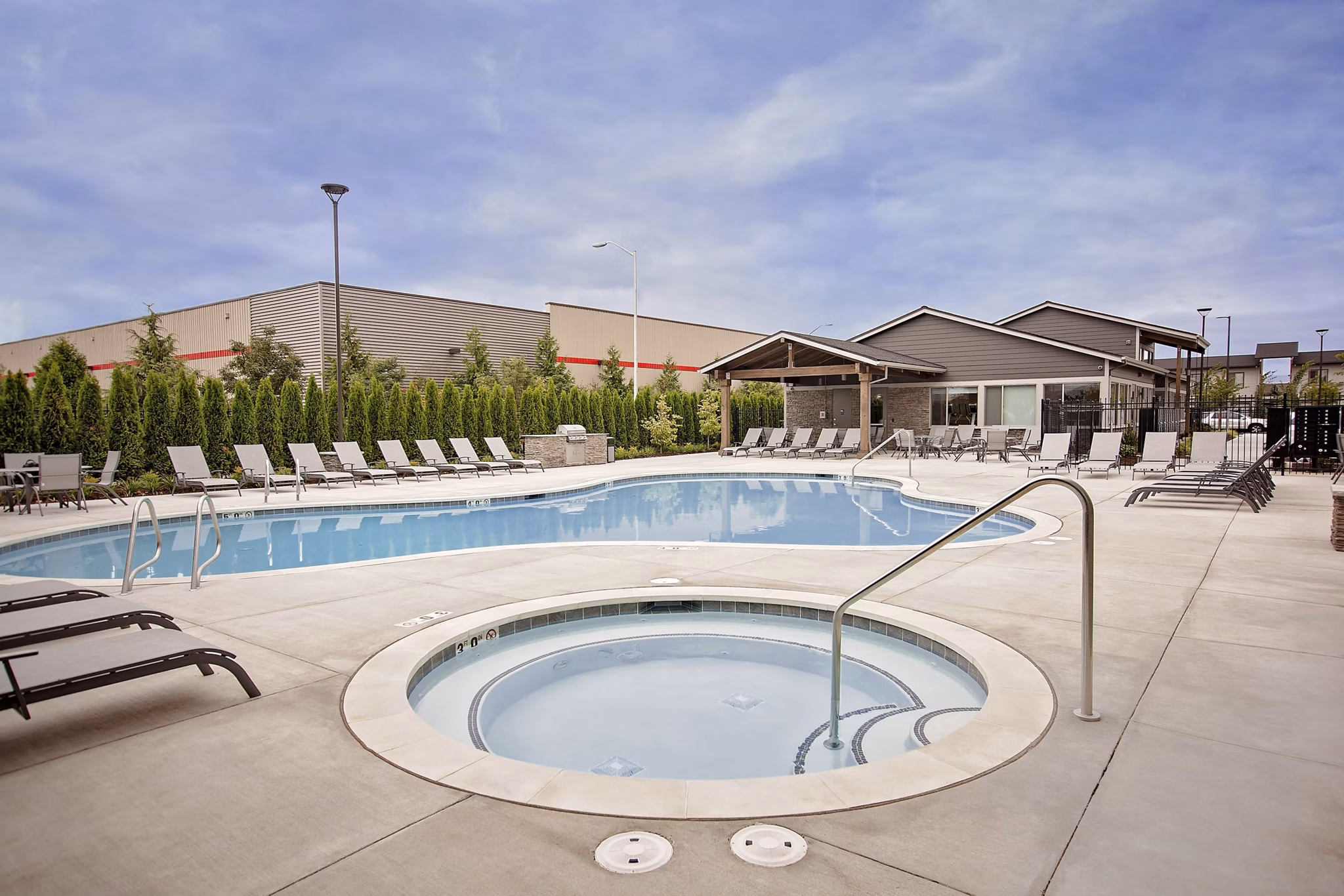 Relaxing outdoor hot tub at Trio Pointe luxury apartments with scenic views