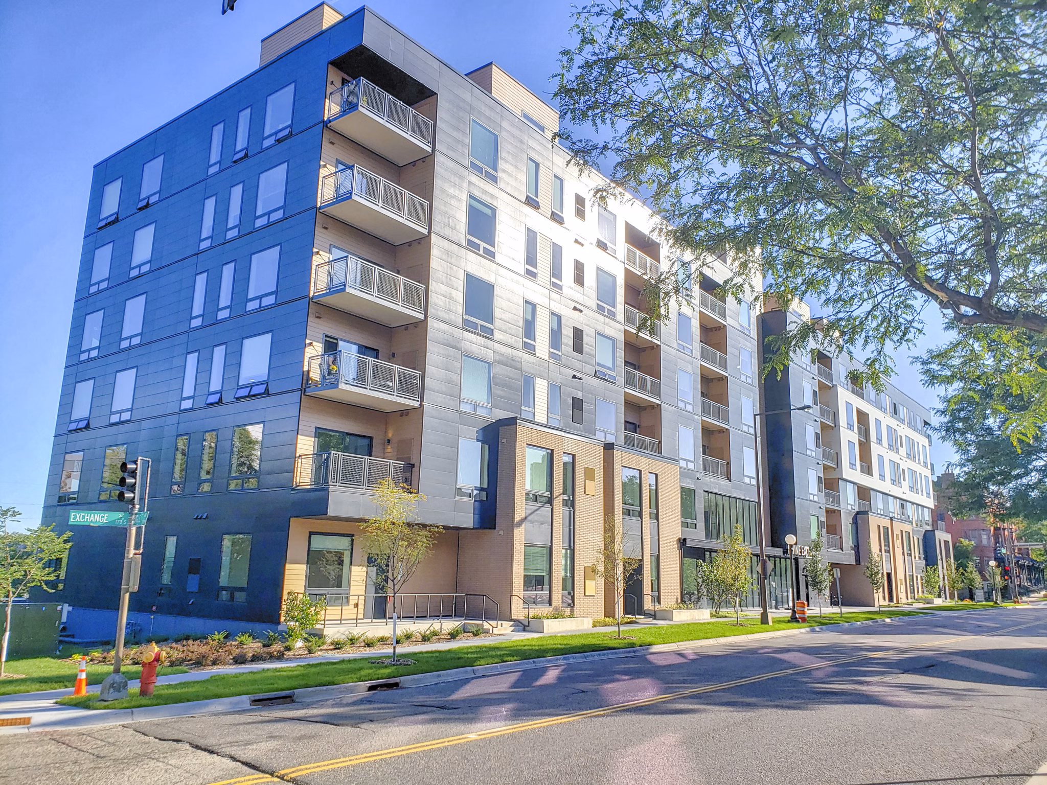 Irvine Exchange Apartments: Contemporary building with sleek design and green landscaping in a luxury apartment community
