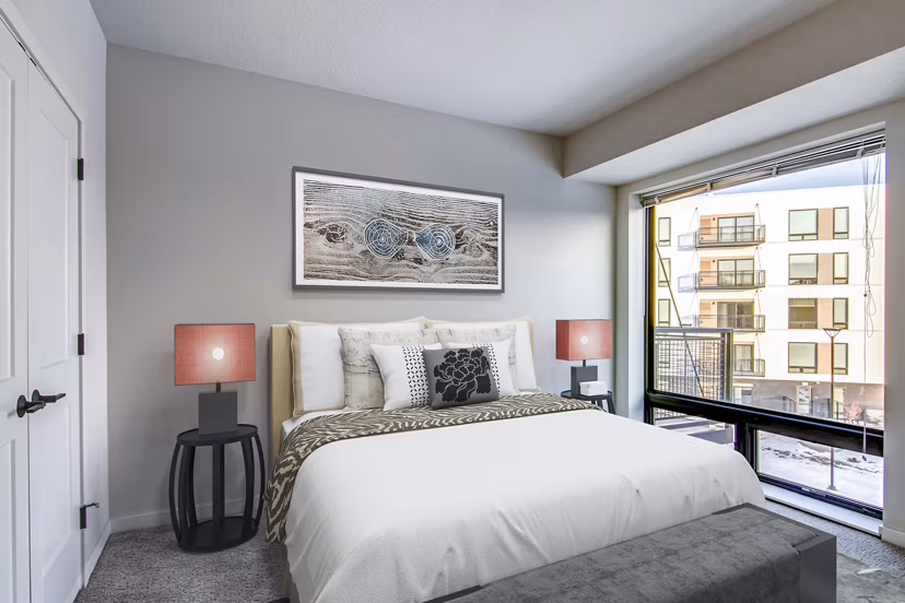 Bedroom with cozy decor and natural light at Irvine Exchange Apartments