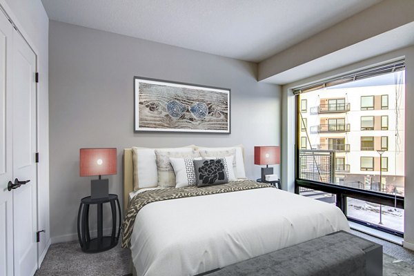 Bedroom with cozy decor and natural light at Irvine Exchange Apartments