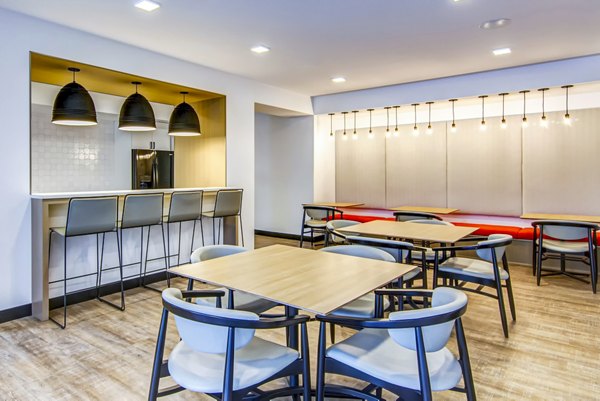 Clubhouse featuring modern lounge seating and billiards table at Irvine Exchange Apartments, luxury apartments in Irvine