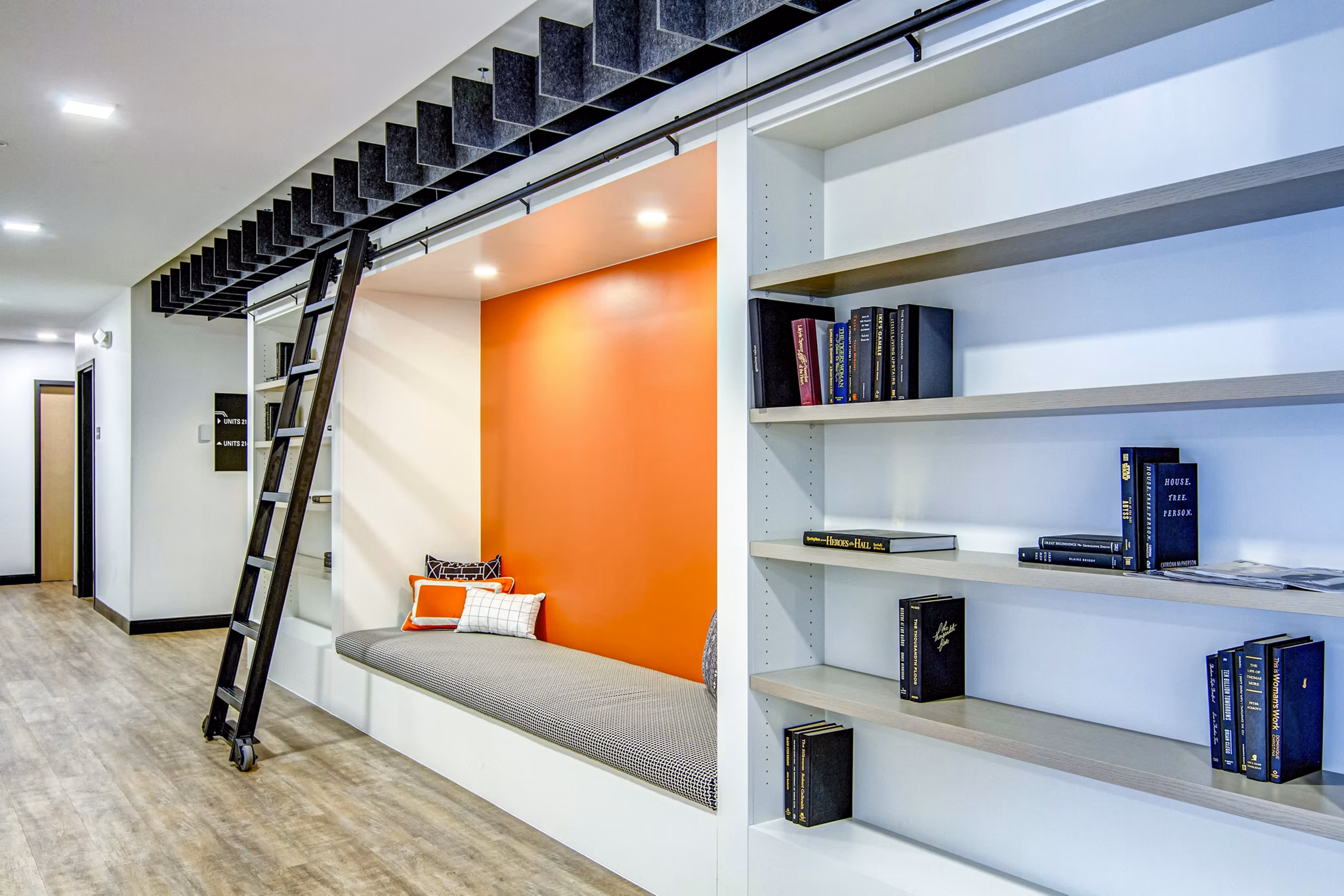 Clubhouse featuring modern decor and communal seating at Irvine Exchange Apartments
