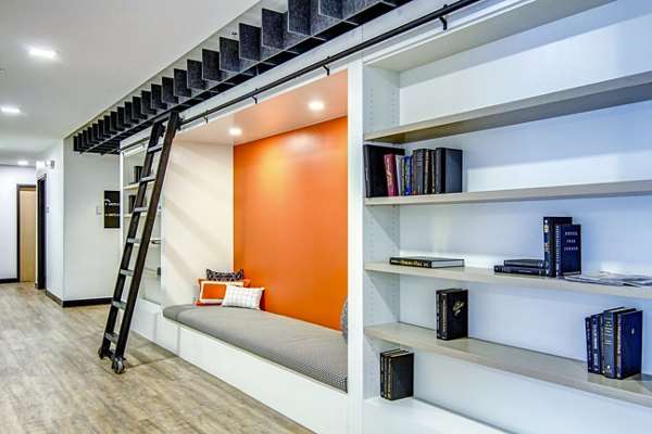 Clubhouse featuring modern decor and communal seating at Irvine Exchange Apartments