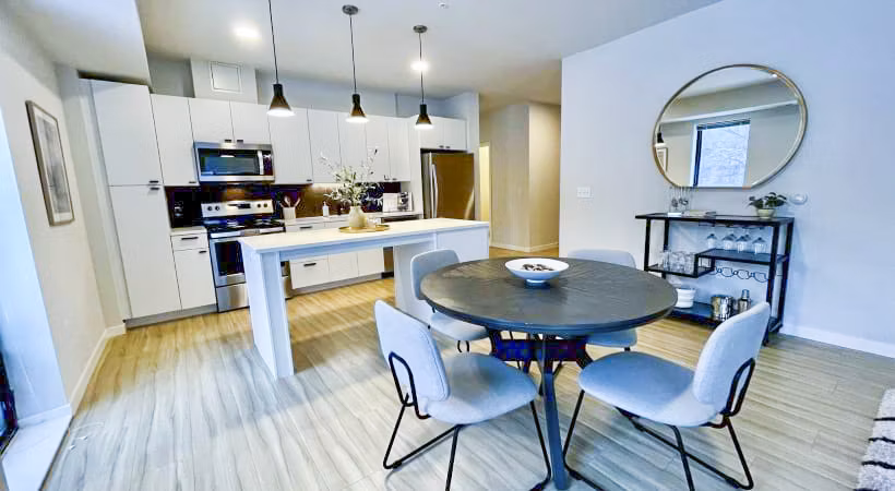 Elegant dining room with modern furnishings at Irvine Exchange Apartments, highlighting luxury living in this premier California community