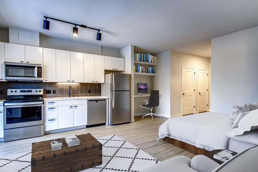 Modern kitchen with stainless steel appliances at Irvine Exchange Apartments
