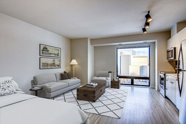 Modern kitchen featuring stainless steel appliances and granite countertops in Irvine Exchange Apartments