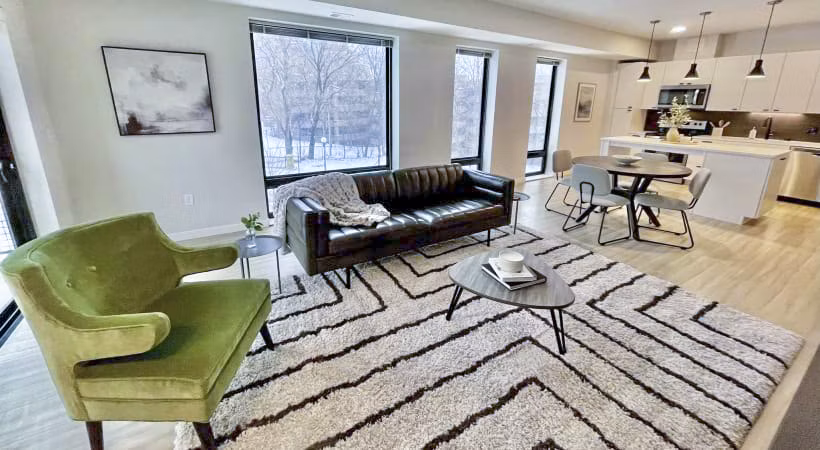 Modern living room featuring sleek design and natural light at Irvine Exchange Apartments