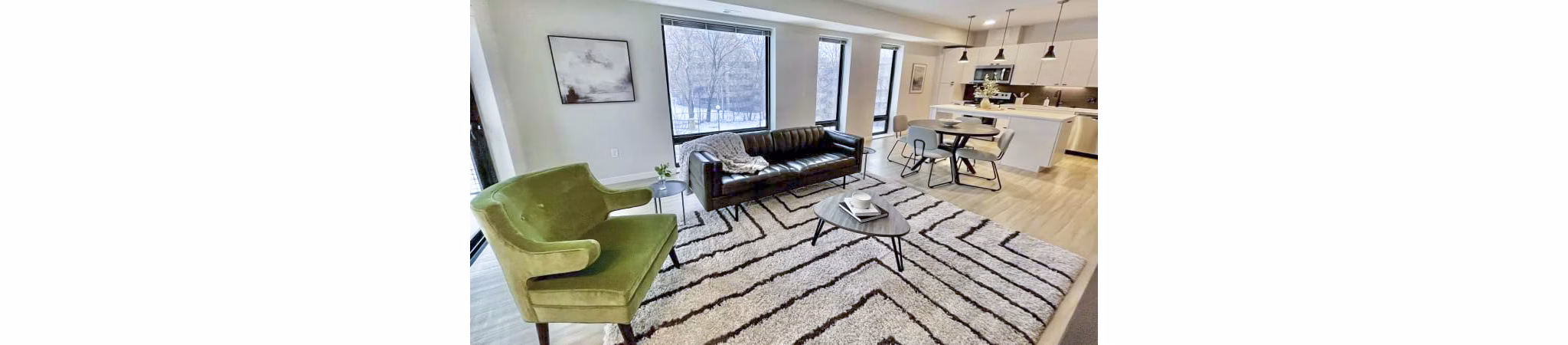 Modern living room featuring sleek design and natural light at Irvine Exchange Apartments