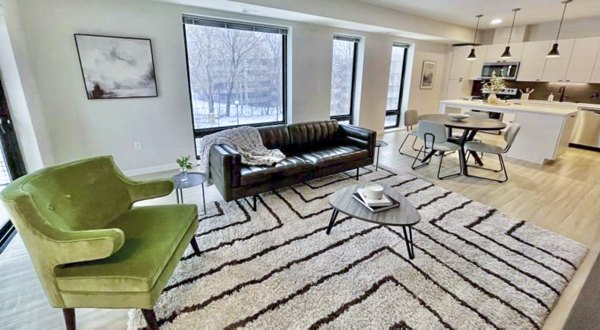 Modern living room featuring sleek design and natural light at Irvine Exchange Apartments