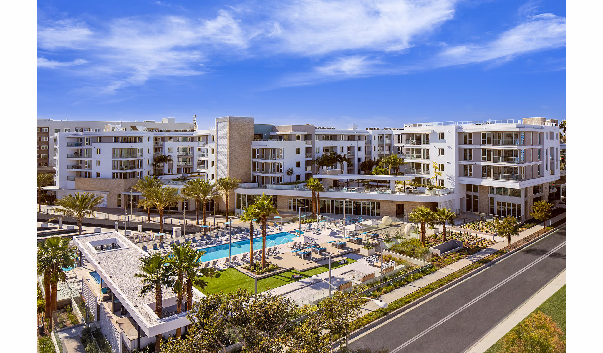 Resort-style pool with lounge chairs at Neptune Marina Apartments in Marina del Rey