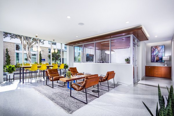 Contemporary clubhouse with sleek dÃ©cor and open seating area at Neptune Marina Apartments