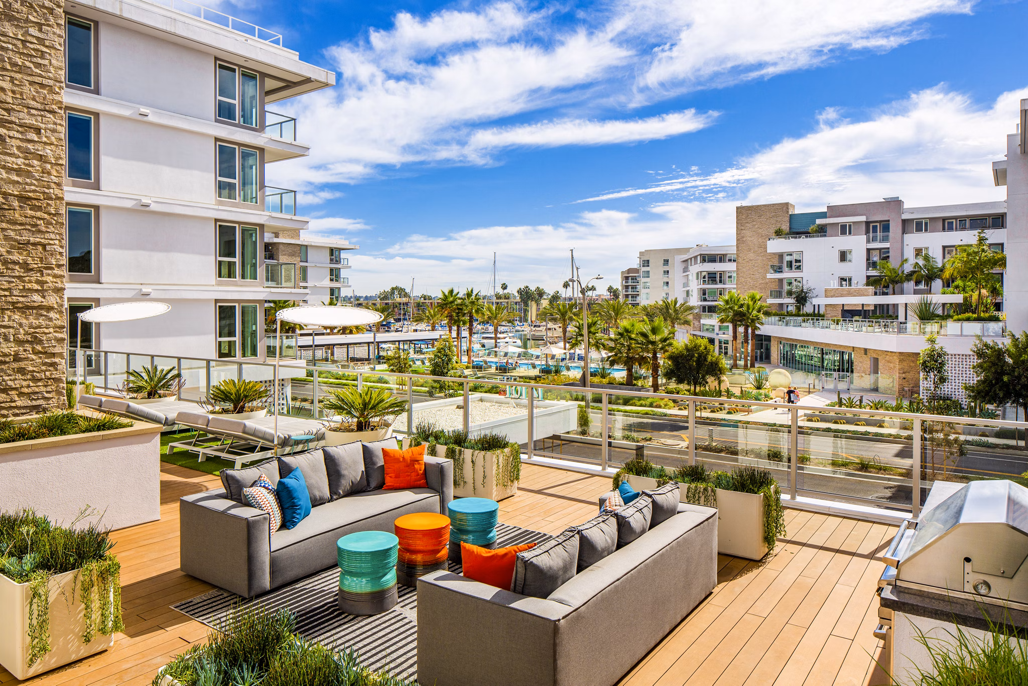 Elegant clubhouse patio with waterfront views at Neptune Marina Apartments