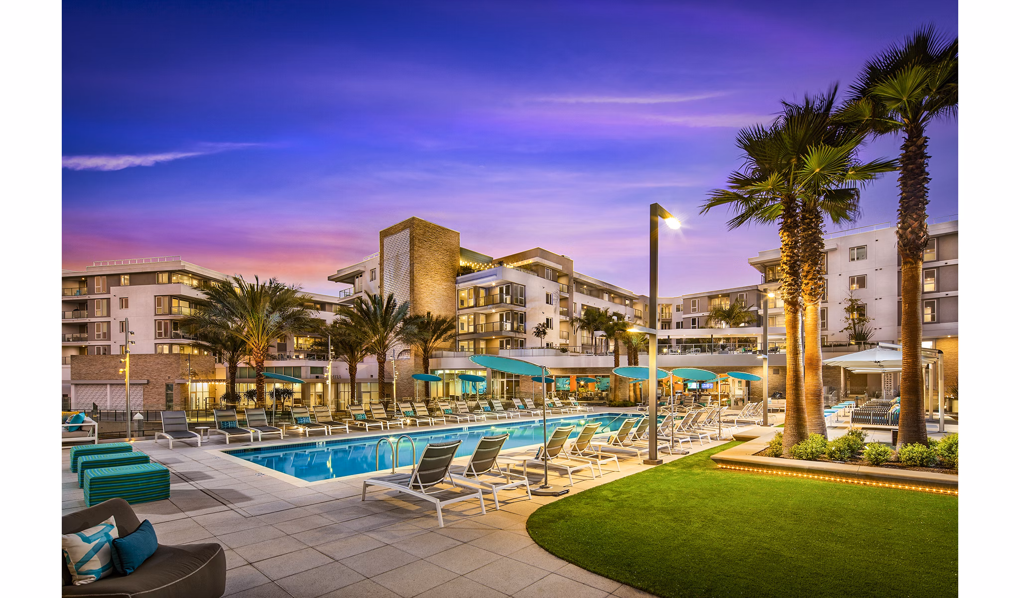 Resort-style pool area at Neptune Marina Apartments overlooking marina, perfect for relaxation and leisure activities