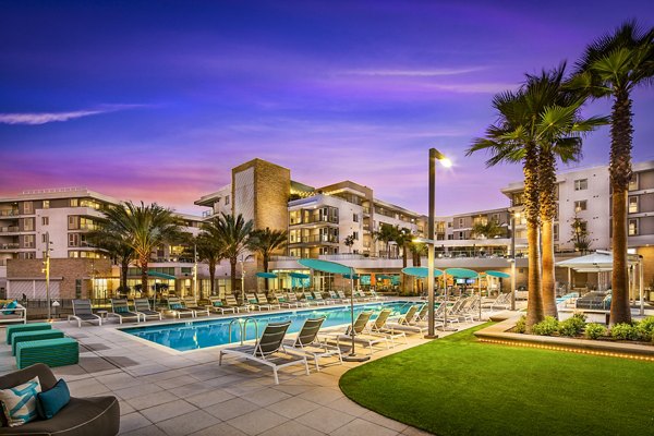 Resort-style pool area at Neptune Marina Apartments overlooking marina, perfect for relaxation and leisure activities