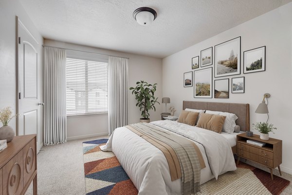 Bedroom closet with custom shelving at The Emerson Apartments providing ample storage space in a luxury setting