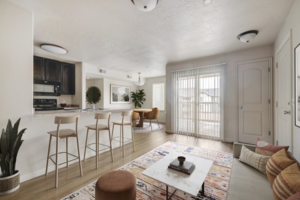 Dining room featuring modern decor and elegant lighting at The Emerson Apartments