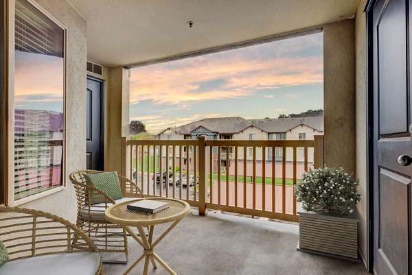 Outdoor grill area with modern patio at The Emerson Apartments, ideal for social gatherings and relaxation