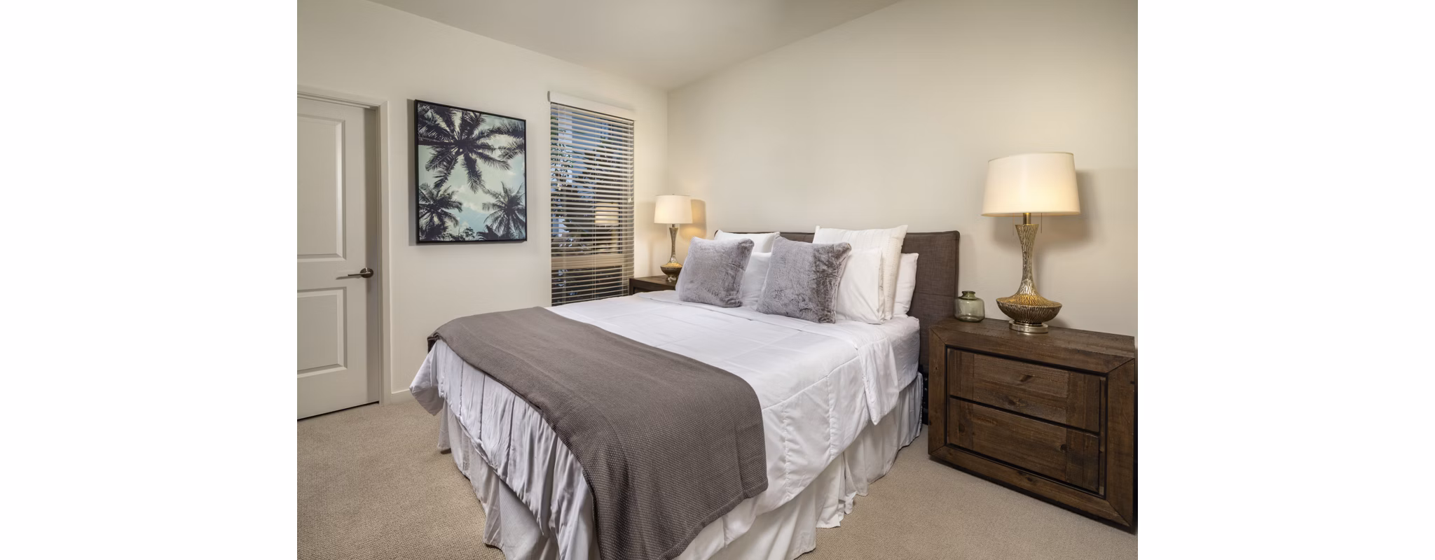 Comfortable bedroom featuring stylish decor at One Paseo Living Apartments