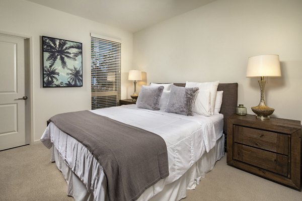 Comfortable bedroom featuring stylish decor at One Paseo Living Apartments