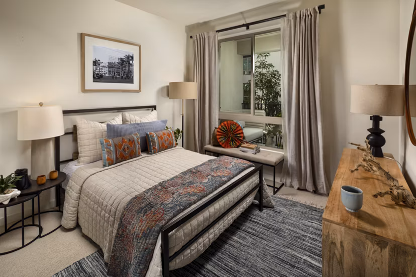 One Paseo Living Apartments: Stylish bedroom with modern decor and ample natural light