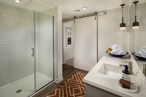 Modern bathroom with sleek fixtures at One Paseo Living Apartments