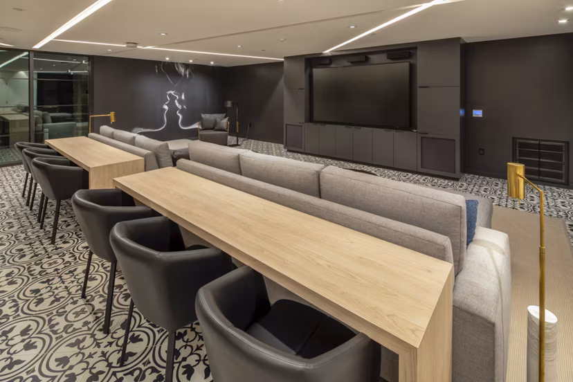 Theater with plush seating at One Paseo Living Apartments, a Greystar luxury property in a prime location