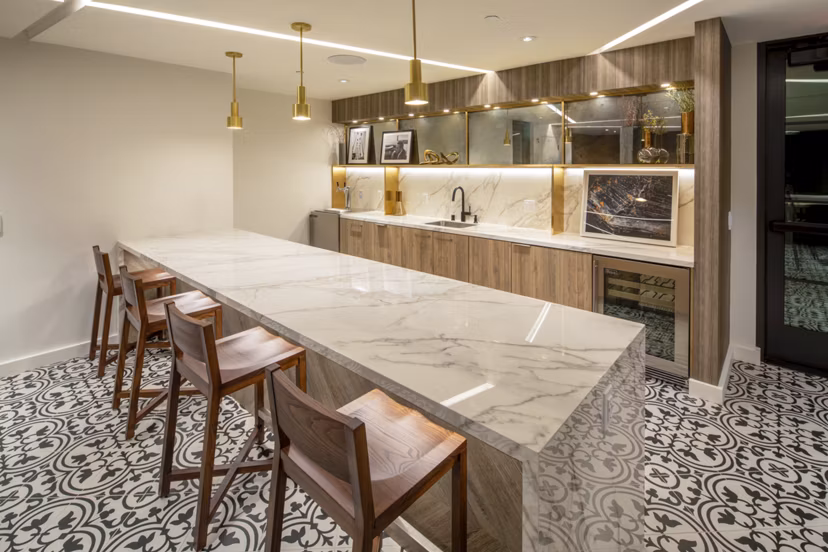 Theater with cozy seating at One Paseo Living Apartments featuring luxury amenities in San Diego