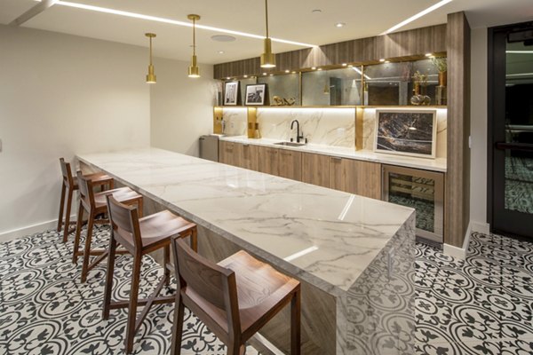 Theater with cozy seating at One Paseo Living Apartments featuring luxury amenities in San Diego