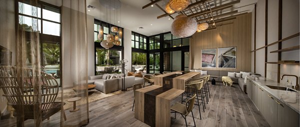 Clubhouse with modern decor at One Paseo Living Apartments offers luxury spaces for socializing and relaxation