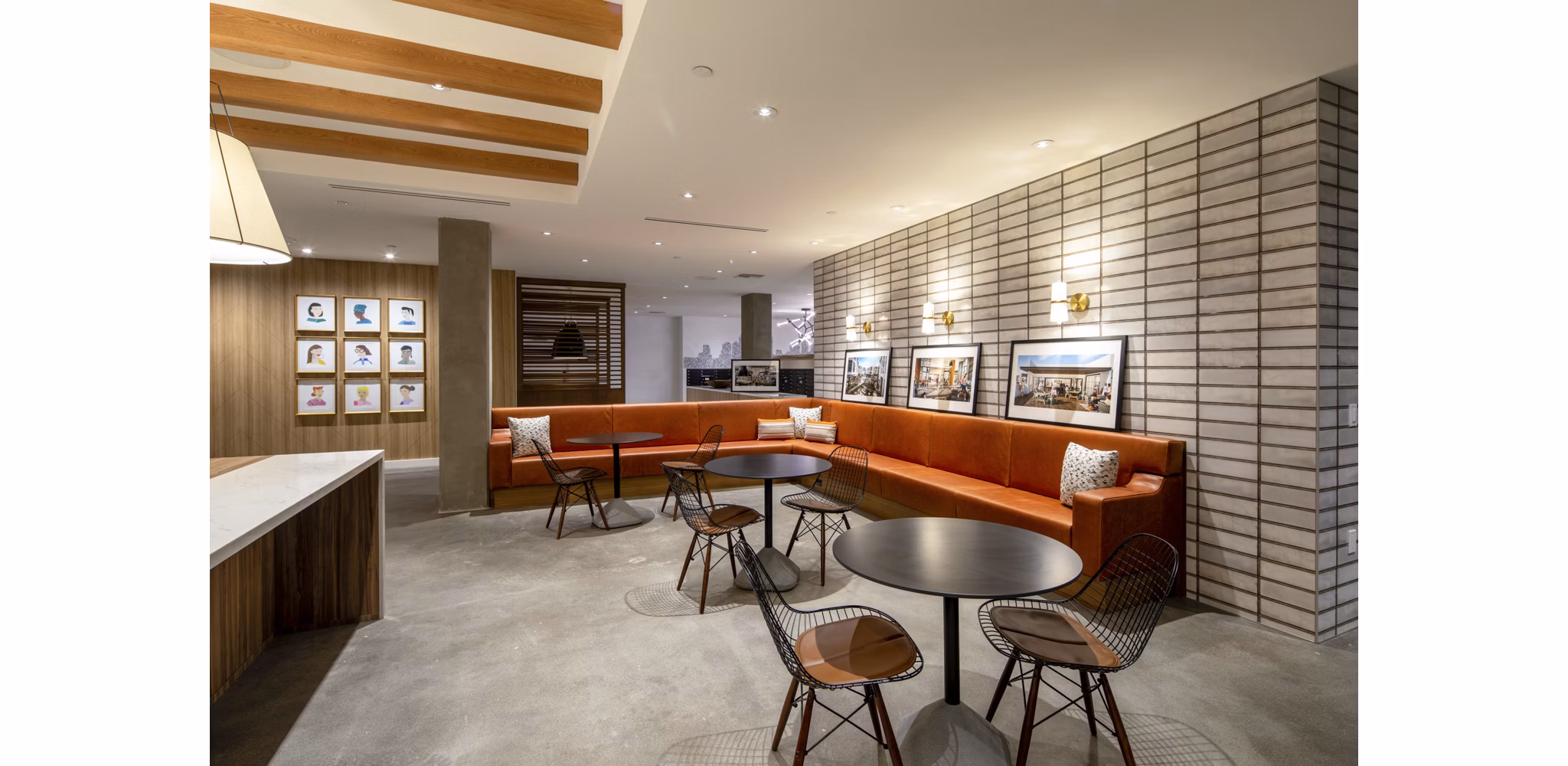 Modern clubhouse featuring cozy seating and a spacious design at One Paseo Living Apartments in vibrant San Diego