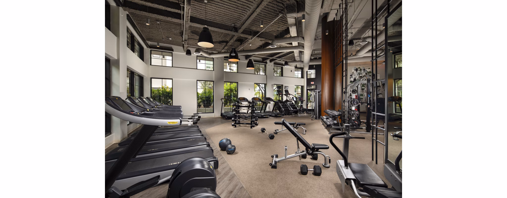 Fully-equipped fitness center at One Paseo Living Apartments