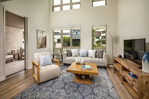 Spacious living room with modern decor at One Paseo Living Apartments