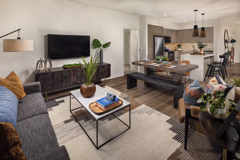 Spacious living room with modern furnishings at One Paseo Living Apartments