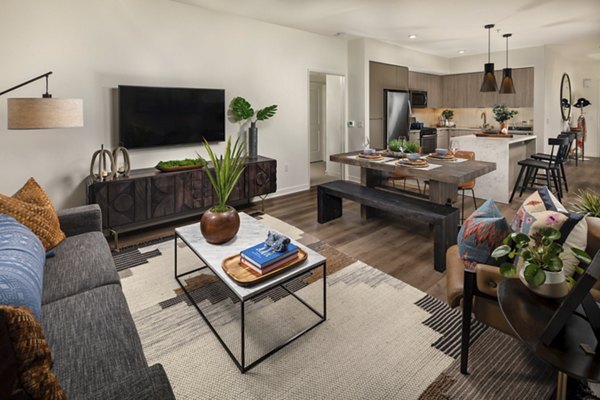 Spacious living room with modern furnishings at One Paseo Living Apartments