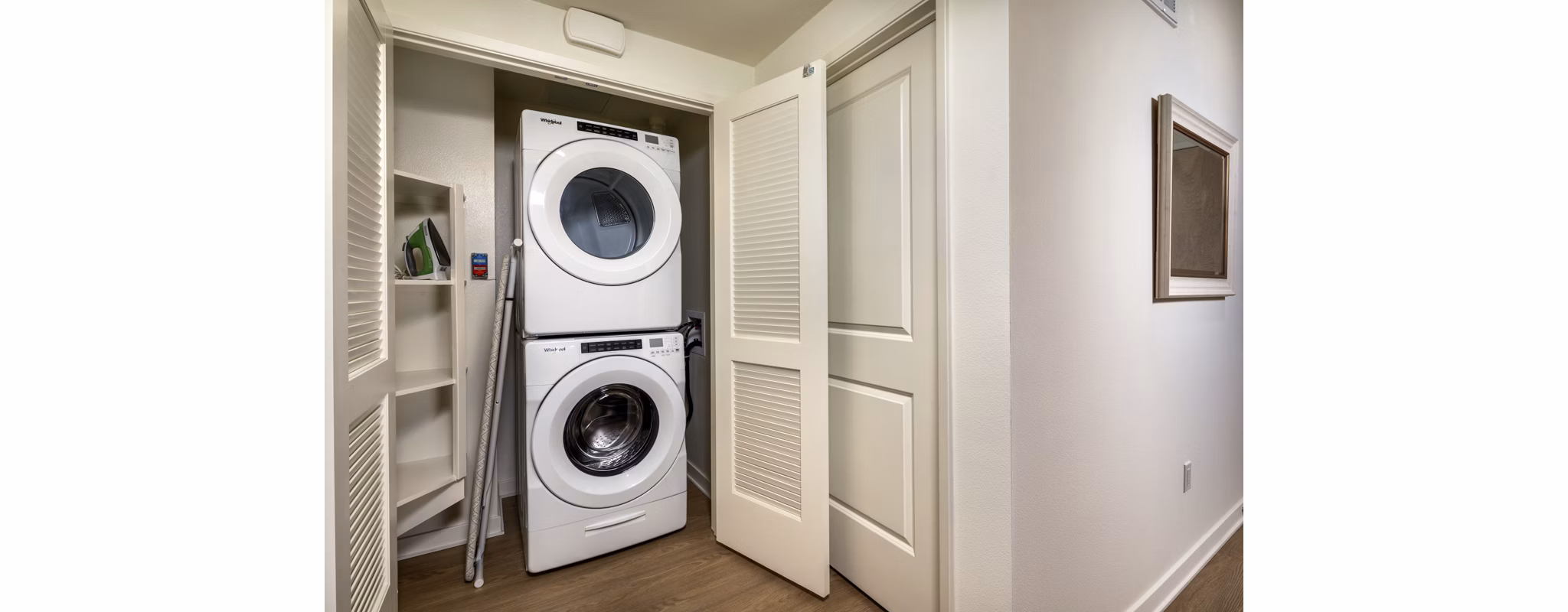 Modern laundry room equipped with high-efficiency washers and dryers at One Paseo Living Apartments