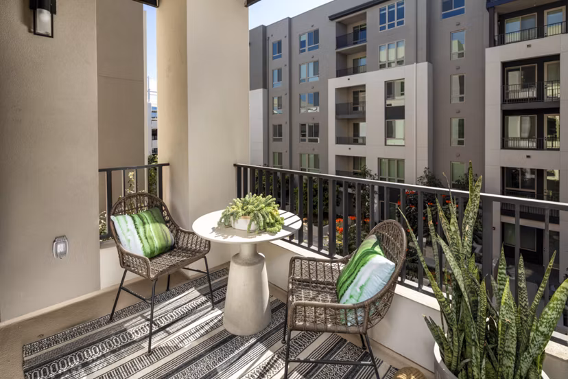 One Paseo Living Apartments: Spacious patio with modern seating in luxury complex