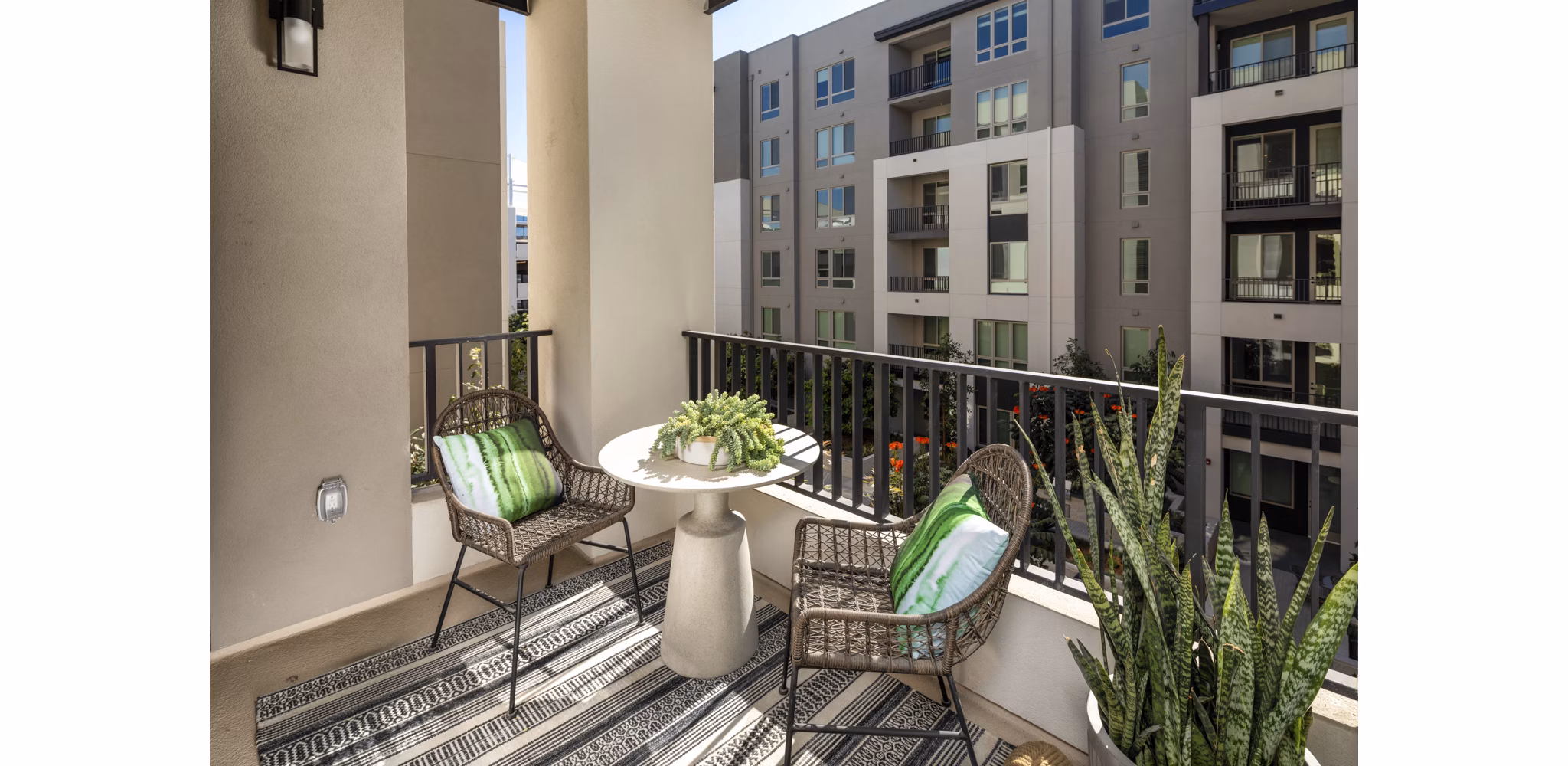 One Paseo Living Apartments: Spacious patio with modern seating in luxury complex