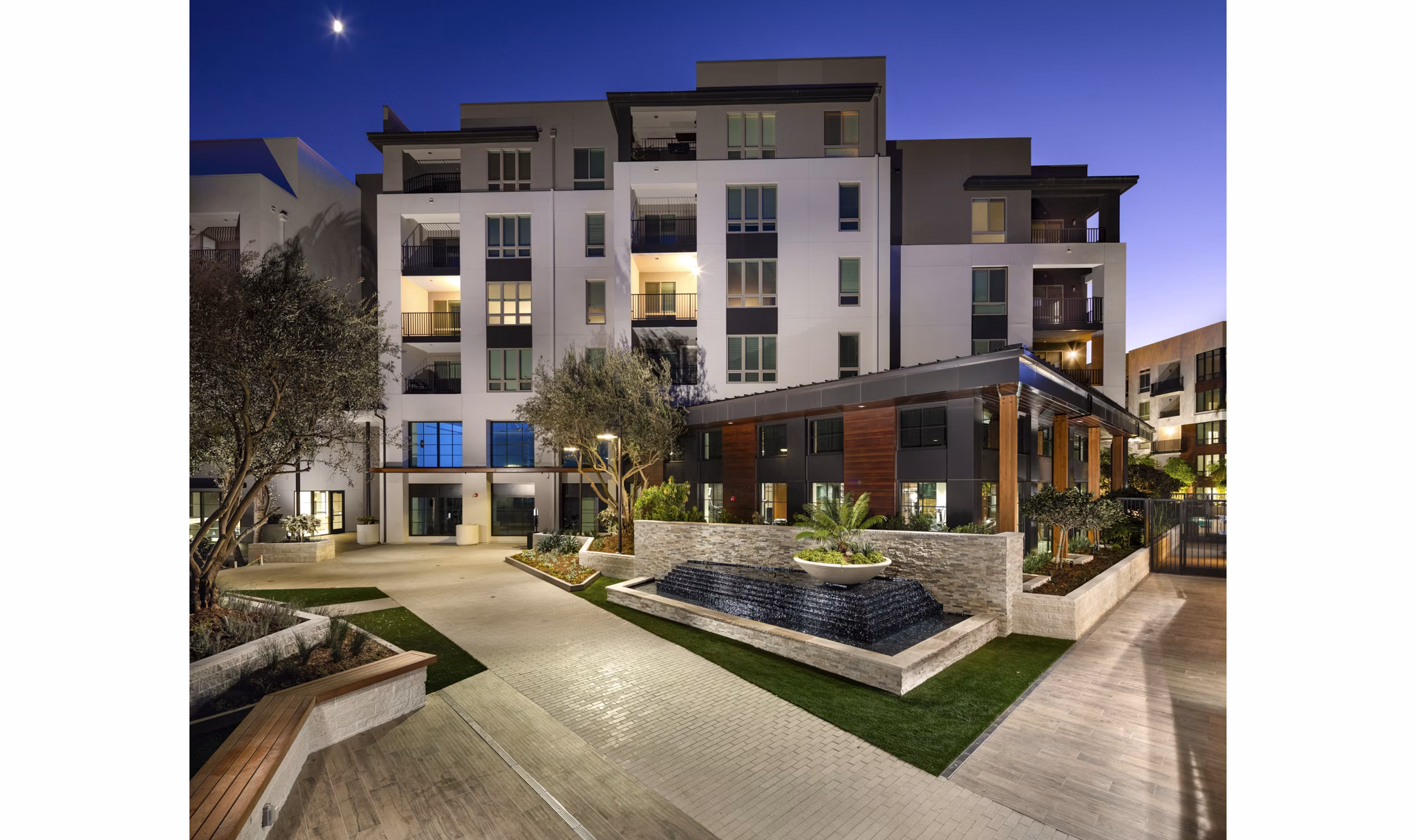 Inviting courtyard with lush landscaping at One Paseo Living Apartments