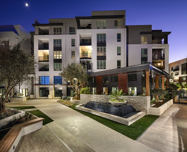 Inviting courtyard with lush landscaping at One Paseo Living Apartments