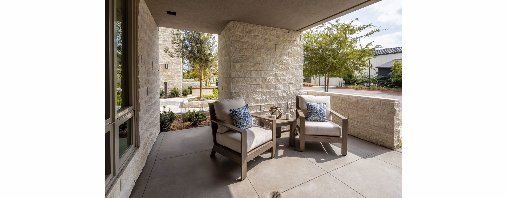 Outdoor patio with modern furniture at One Paseo Living Apartments