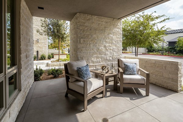 Outdoor patio with modern furniture at One Paseo Living Apartments