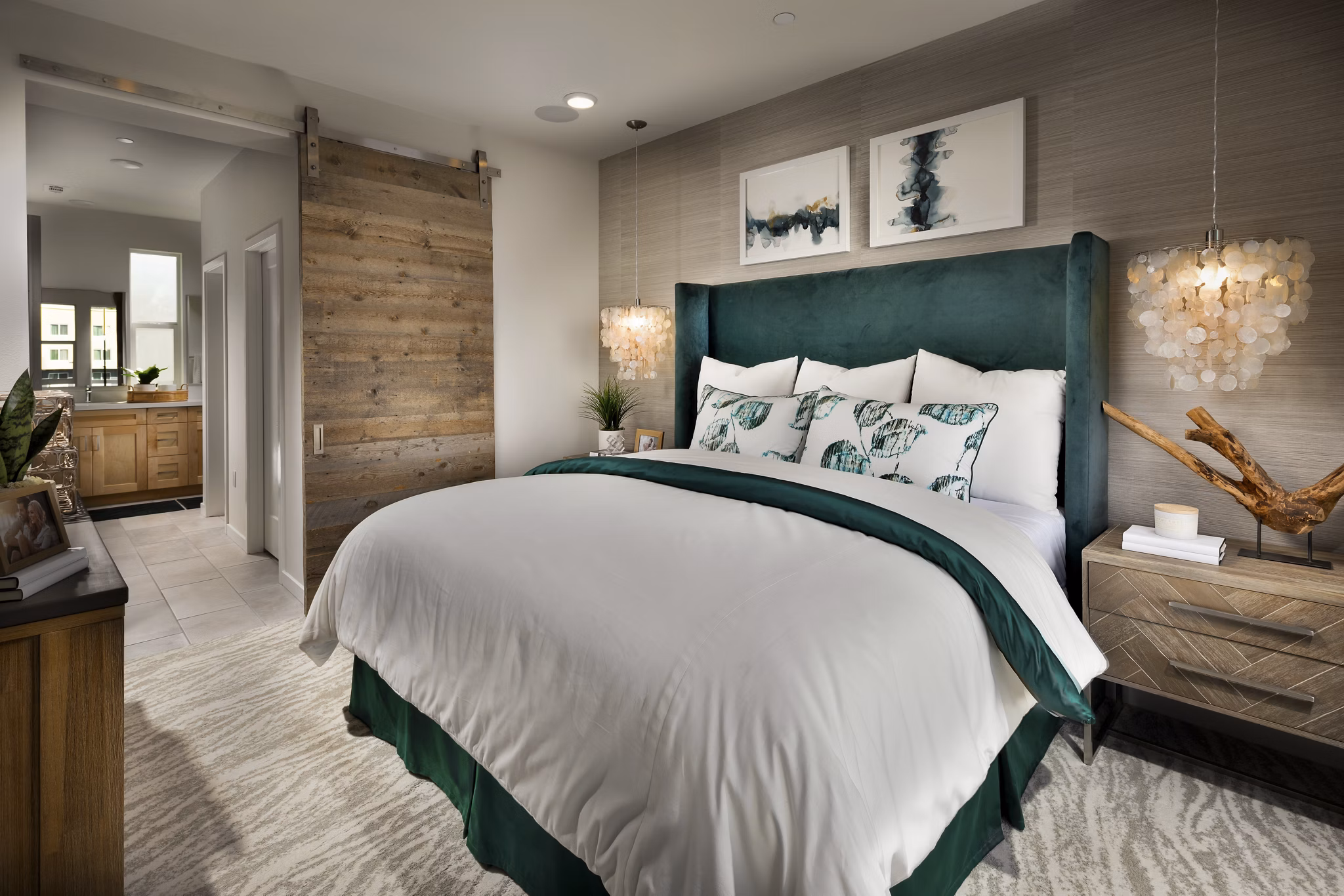 Cozy bedroom with modern decor in Anden Apartments, featuring luxurious bedding and ample natural light