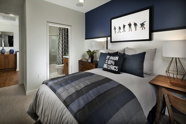 Cozy bedroom featuring modern design elements at Anden luxury apartments