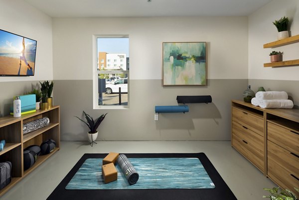 Tranquil yoga and spin studio with modern equipment at Anden luxury apartments