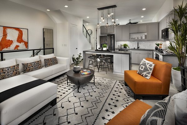 Spacious living room with modern decor in Anden luxury apartments